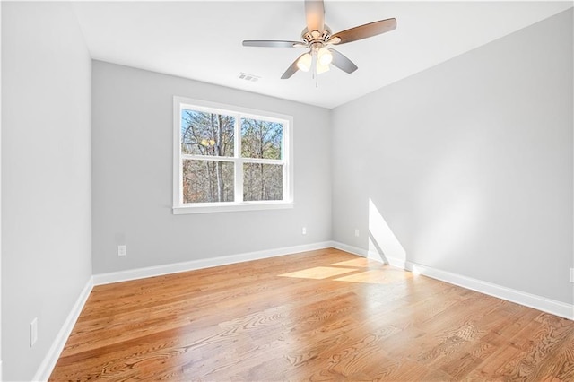 unfurnished room with ceiling fan and light hardwood / wood-style flooring