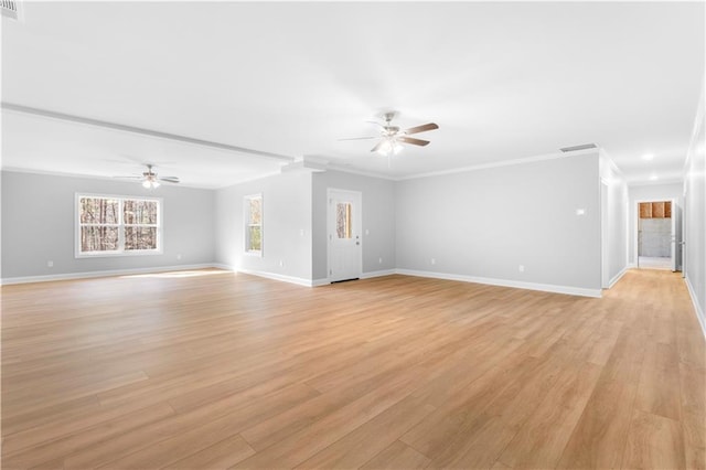 unfurnished living room with ceiling fan, ornamental molding, and light hardwood / wood-style floors