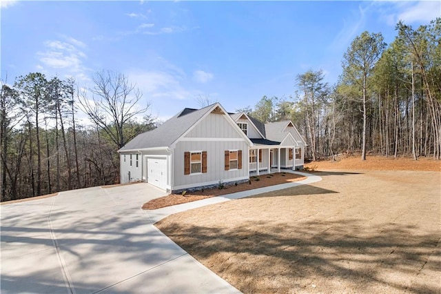 view of front of home with a garage and a porch