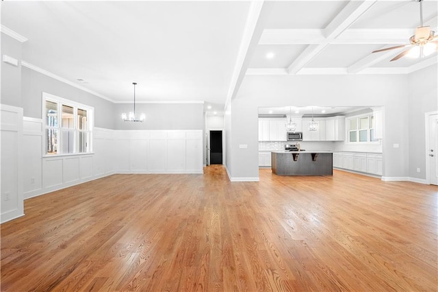 unfurnished living room featuring beam ceiling, light wood-type flooring, ceiling fan with notable chandelier, and coffered ceiling