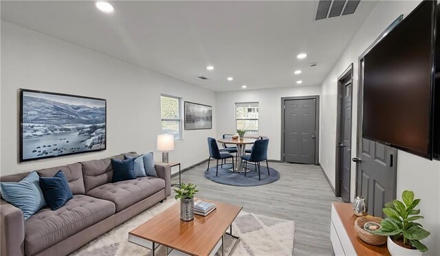 kitchen with visible vents, gray cabinetry, a sink, tasteful backsplash, and stainless steel appliances