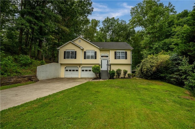 115 Donna Dr, Dawsonville, GA 30534 - raised ranch with concrete driveway, a front yard, and a garage