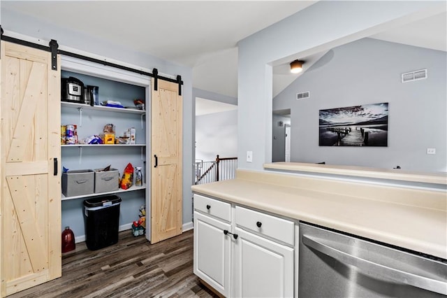 115 Donna Dr, Dawsonville, GA 30534 - kitchen featuring dishwasher, a barn door, dark wood-type flooring, white cabinets, and vaulted ceiling