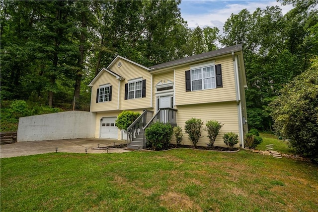 115 Donna Dr, Dawsonville, GA 30534 - bi-level home featuring concrete driveway, an attached garage, and a front lawn