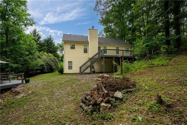 115 Donna Dr, Dawsonville, GA 30534 - rear view of property featuring a wooden deck, stairway, a chimney, and a yard