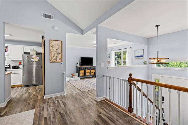 115 Donna Dr, Dawsonville, GA 30534 - corridor with dark wood finished floors, a chandelier, an upstairs landing, and vaulted ceiling