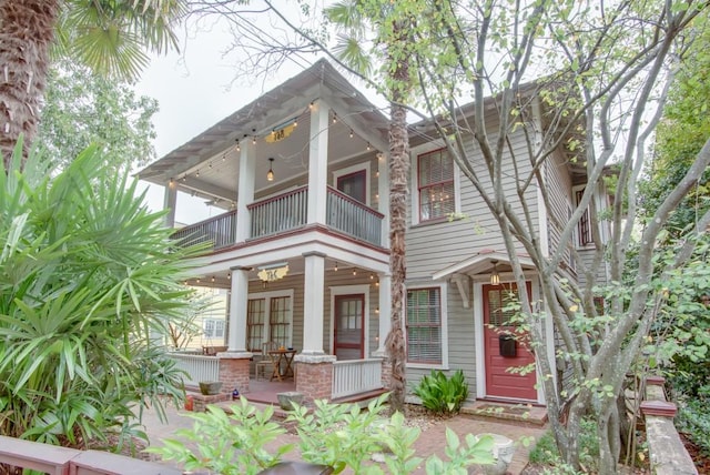 view of front facade featuring a balcony and a porch