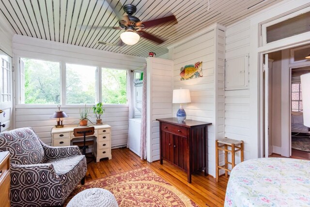 sunroom featuring wooden ceiling and ceiling fan