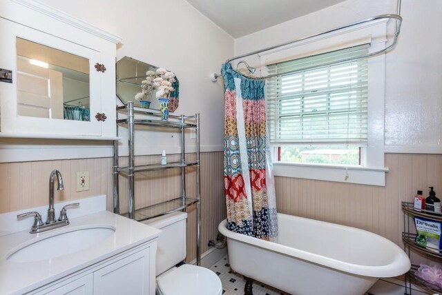 full bathroom with independent shower and bath, tile patterned flooring, vanity, and toilet