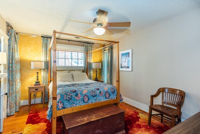 bedroom featuring ceiling fan and hardwood / wood-style flooring