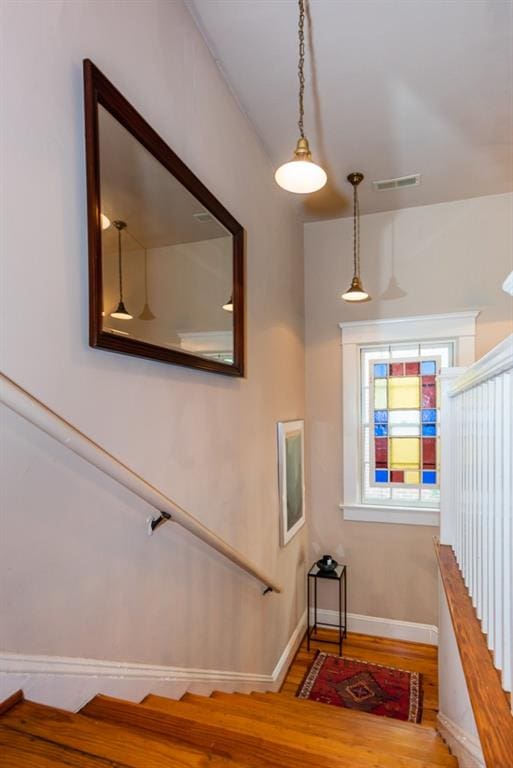 stairway featuring hardwood / wood-style floors