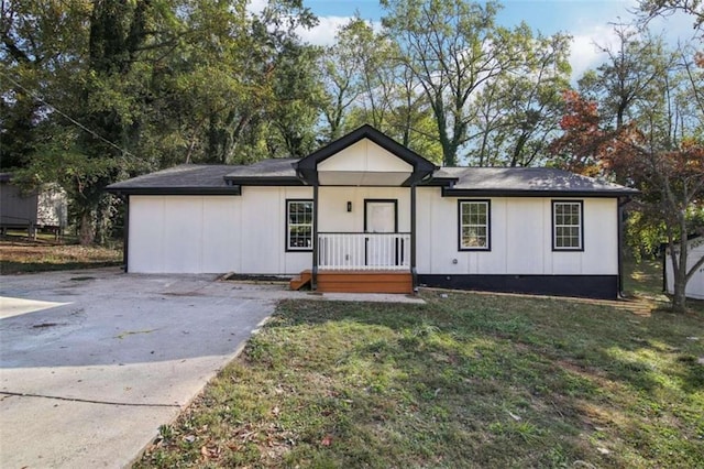 view of front of house with a front yard and a porch