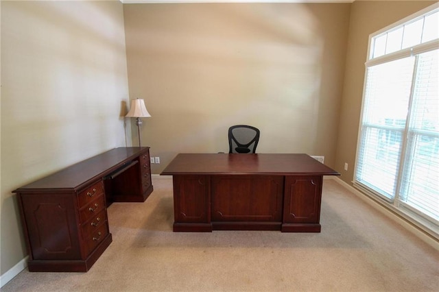office with light carpet and baseboards
