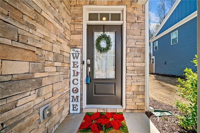 entrance to property featuring board and batten siding