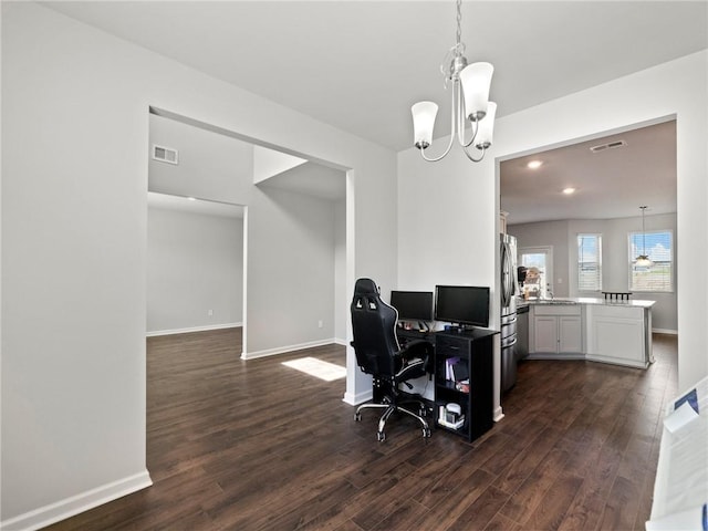 office area featuring a notable chandelier, visible vents, baseboards, and dark wood-style flooring