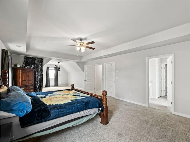 bedroom with a ceiling fan, carpet, baseboards, visible vents, and a raised ceiling