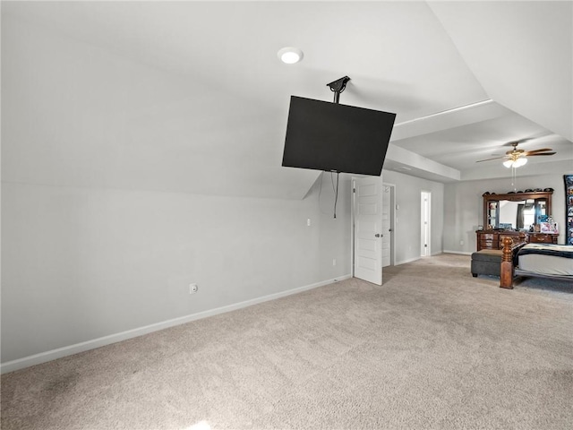 unfurnished living room featuring ceiling fan, baseboards, and light colored carpet