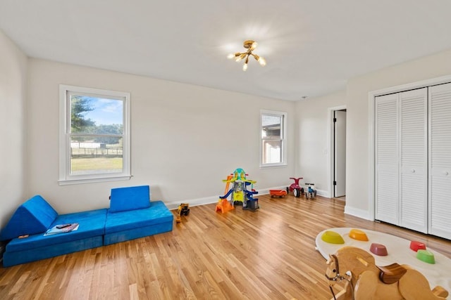 game room featuring baseboards and wood finished floors