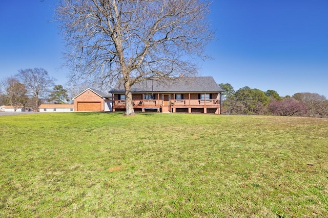 back of property featuring a deck and a yard