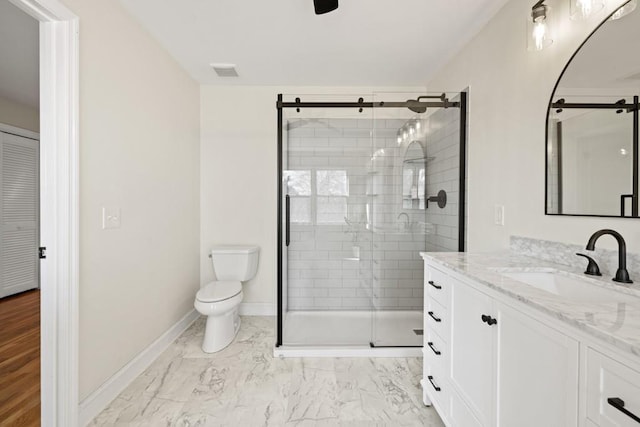 bathroom featuring vanity, visible vents, a shower stall, toilet, and marble finish floor