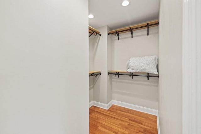 spacious closet with light wood finished floors