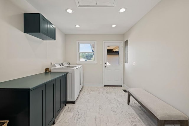 clothes washing area featuring electric panel, recessed lighting, cabinet space, washer and dryer, and marble finish floor