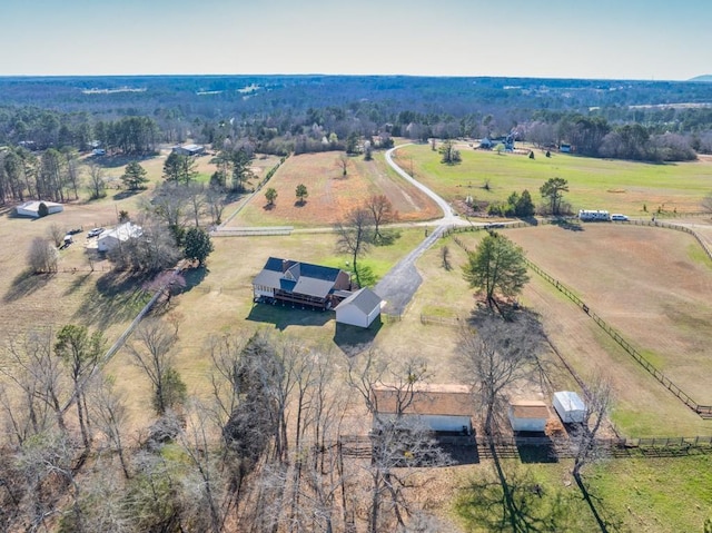 birds eye view of property with a rural view