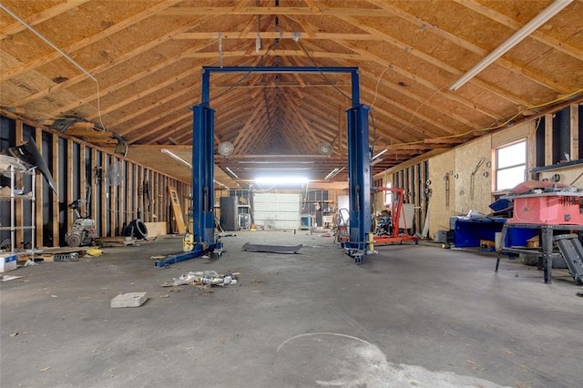 miscellaneous room with concrete floors and vaulted ceiling