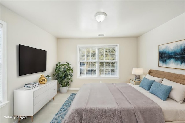 bedroom featuring light carpet