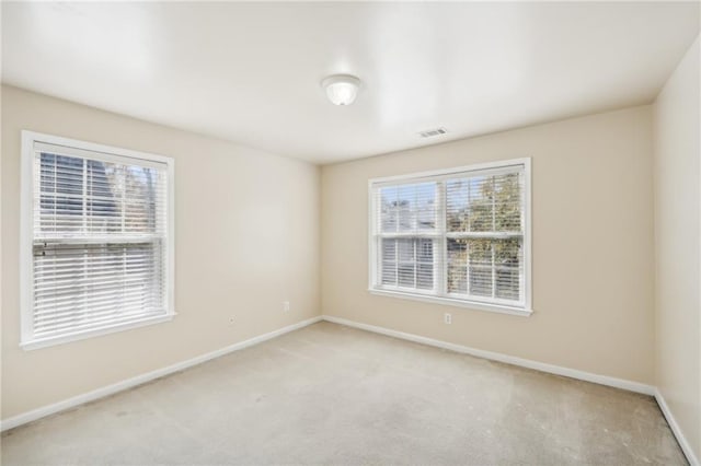 spare room featuring carpet flooring