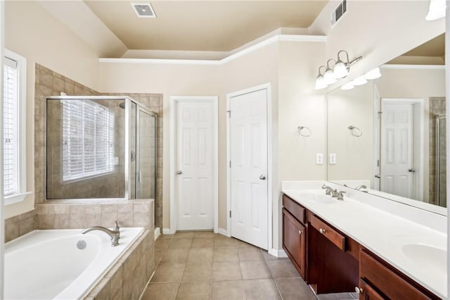 bathroom featuring plus walk in shower, lofted ceiling, tile patterned floors, and vanity