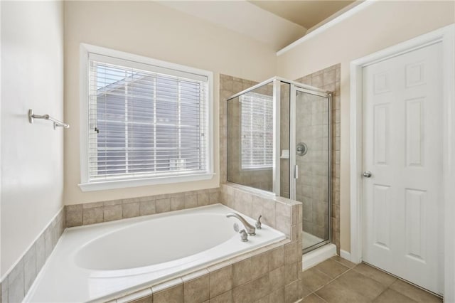 bathroom with separate shower and tub and tile patterned floors