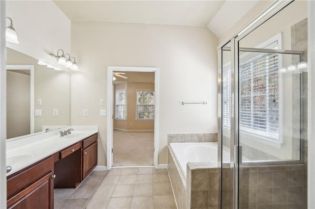 bathroom with lofted ceiling, vanity, independent shower and bath, and tile patterned flooring