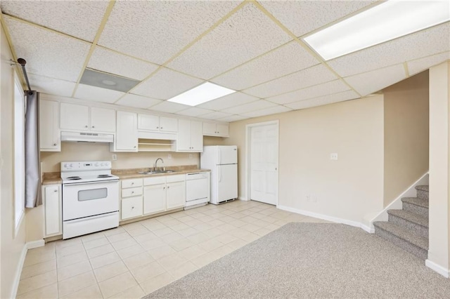 kitchen featuring white cabinetry, sink, and white appliances