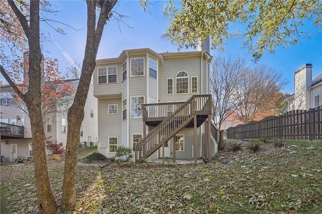 rear view of house with a wooden deck