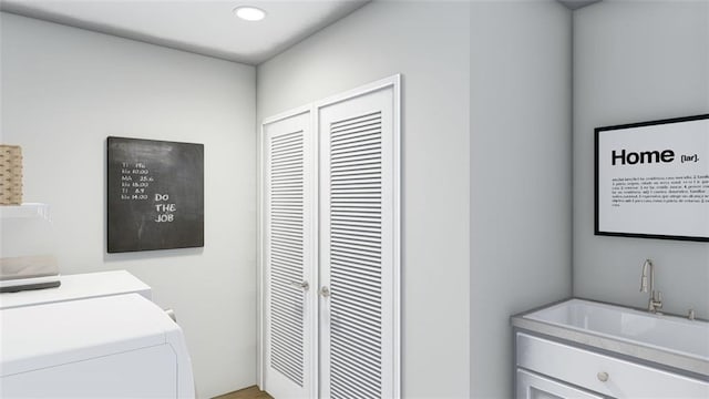 laundry room featuring separate washer and dryer and sink