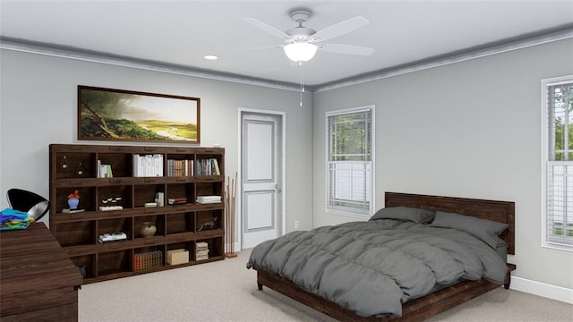 bedroom featuring crown molding, carpet floors, and ceiling fan