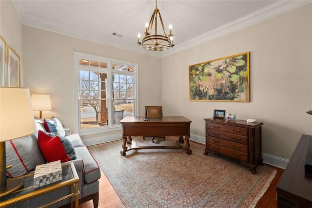 home office featuring crown molding, hardwood / wood-style floors, and an inviting chandelier