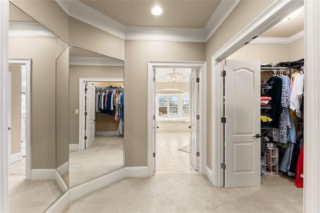 interior space featuring crown molding and light carpet