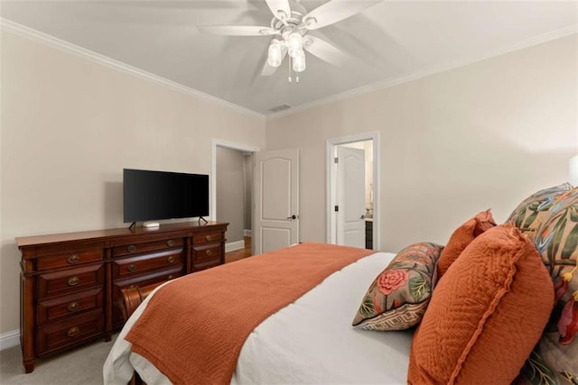 bedroom with ceiling fan, ornamental molding, and light carpet