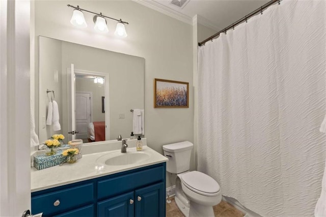 bathroom with vanity, crown molding, tile patterned floors, and toilet