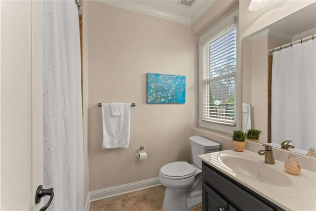 bathroom with ornamental molding, vanity, and toilet