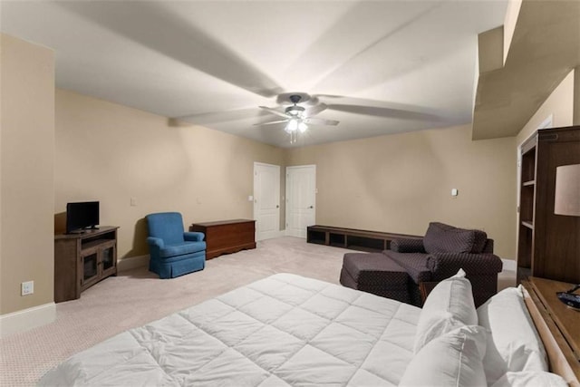 bedroom featuring light carpet and ceiling fan