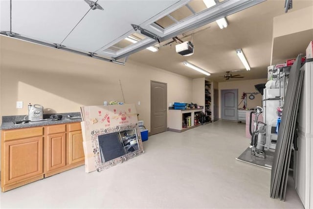 garage featuring ceiling fan and a garage door opener