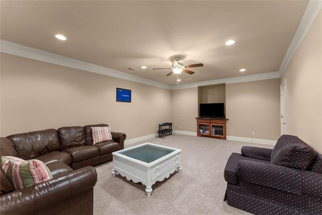 carpeted living room featuring ornamental molding and ceiling fan