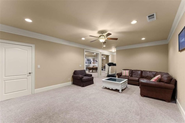 carpeted living room featuring ceiling fan and ornamental molding