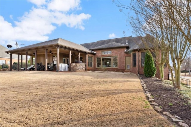 back of property featuring ceiling fan