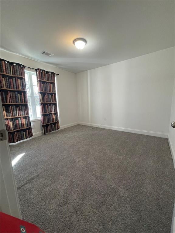 empty room featuring carpet floors