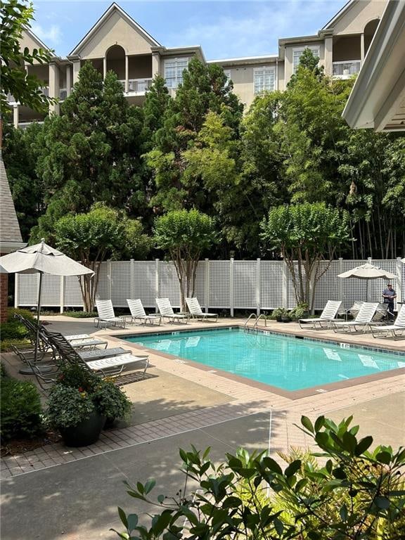 view of swimming pool with a patio