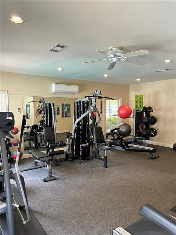 workout area with carpet floors, an AC wall unit, and ceiling fan